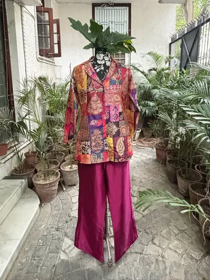 The third variation is a chic co-ord set with a shorter jacket and flared pants.
