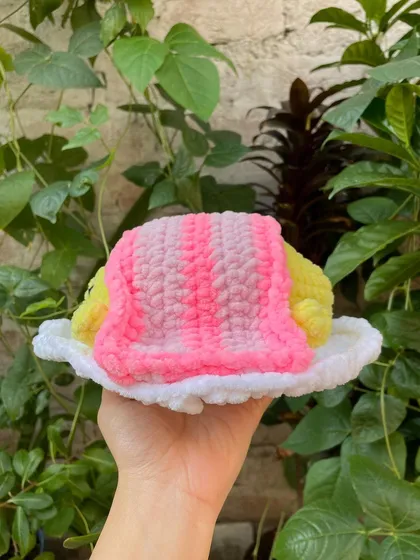 Here is Gudetama tucked under his little bacon blanket. I used different shades of pink to create the striped look on the blanket.