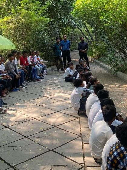 Students from Free Paathshala sit and listen attentively during an educational session at the Chakkarpur Wazirabad Bundh.