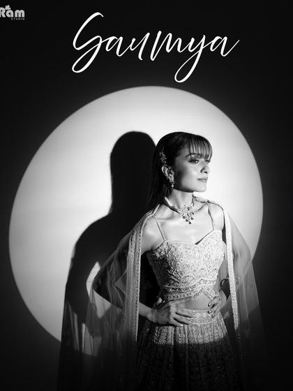 A powerful black and white bridal portrait with a strong shadow. This high-contrast, graphic style creates a bold and fashionable image that is both artistic and timeless.