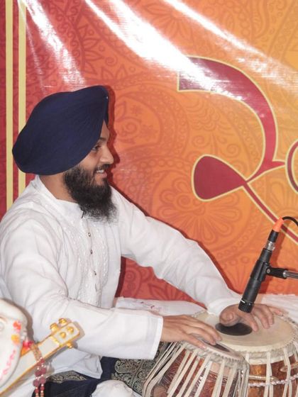 A side profile during the Delhi concert, captured in a moment of rhythmic flow.