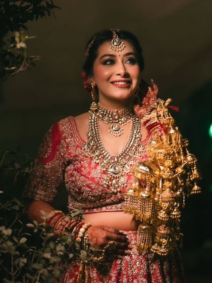 The joy of a bride holding her kaleeras. The makeup is designed to photograph beautifully, capturing these special moments perfectly.