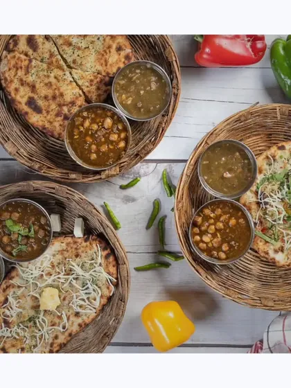 A delicious spread of Amritsari Kulcha served with chole and chutney. This flat-lay shot showcases the hearty and flavorful Punjabi cuisine I offer.