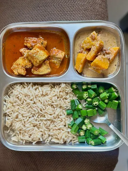 A delicious meal of brown rice, fish curry, pumpkin and lentil curry, and sautéed okra. This plate is rich in protein, omega-3s, and fiber.