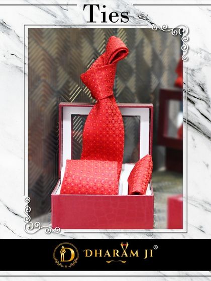 A vibrant red tie and pocket square set. A pop of color like this can completely transform a suit.