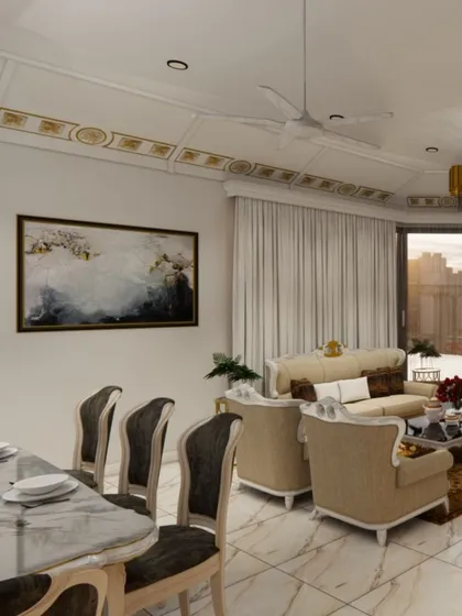 An expansive view of a luxurious open-plan living and dining area, showcasing a harmonious blend of classic and contemporary styles. Notice the detailed ceiling work with gold accents, plush furnishings, and marble flooring that create an atmosphere of sophisticated comfort.