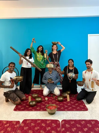A fun and joyful photo of our Sound Healing graduates, playing with their bowls and instruments.