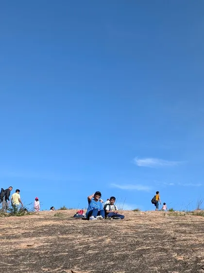 Taking a moment to relax and enjoy the vast, open landscape. Our treks provide the space for families to unwind and connect with nature on a grand scale.