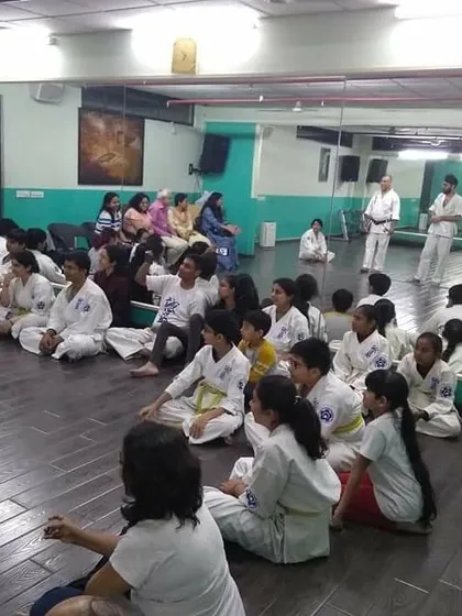 The entire dojo, including students and their families, gathers to wish Senpai Harjas well. This is what our community is all about.