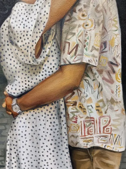 A detail shot of the couple's embrace and the interesting patterns on their clothes.
