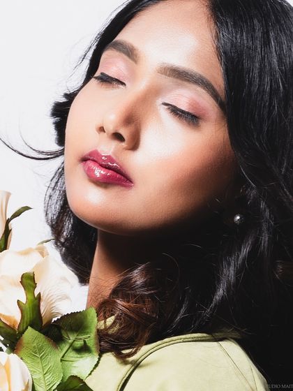 A serene beauty shot with the model's eyes closed, creating a peaceful mood.