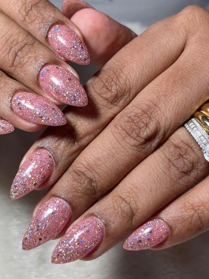 Bridesmaid nails need to be just as polished. This sparkling pink glitter set is a perfect choice for the bridal party, offering plenty of glam without upstaging the bride.