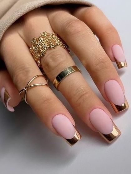 A modern and luxurious French manicure. This design uses a matte pink base with a striking rose gold chrome tip on a sharp square shape. The mix of matte and metallic textures creates a truly high-fashion look.