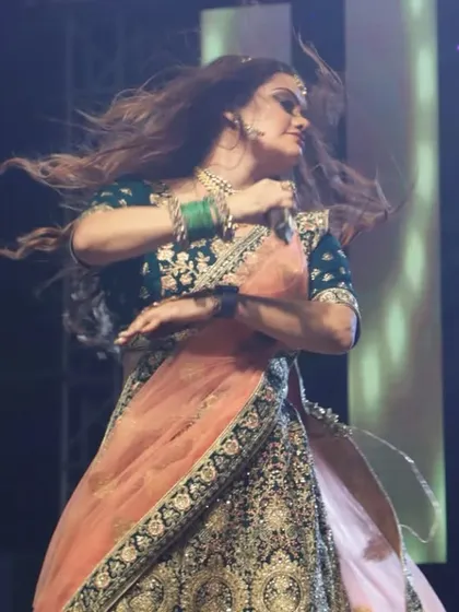 A dynamic shot of one of us dancing on stage, with hair flying. Our performances are full of movement and energy.