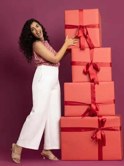 So many presents! Another shot from the festive campaign, showing off a great pair of white wide-leg trousers.