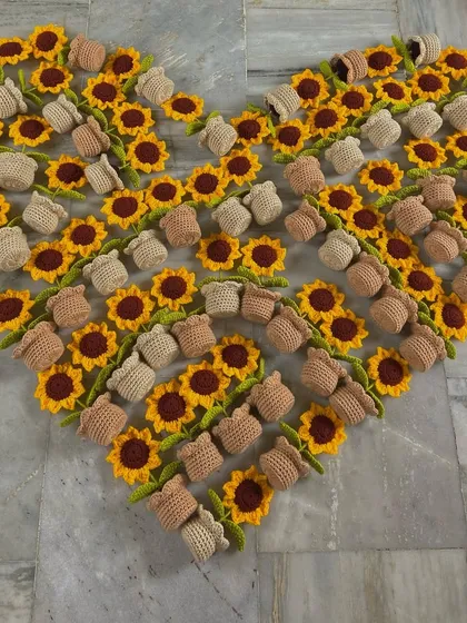 A heart filled with my bestselling potted sunflowers, showing just how many I can make for a single order.