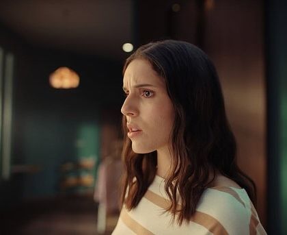 Another expressive shot of the actress. The neutral-toned, casual styling ensures the focus remains on her performance and the story.