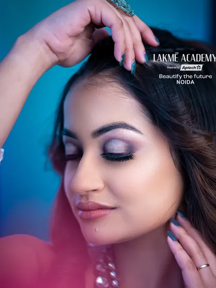 A soft and shimmery cocktail makeup look. This close-up shows a beautifully blended silver and grey smokey eye, a versatile look for any party or reception.