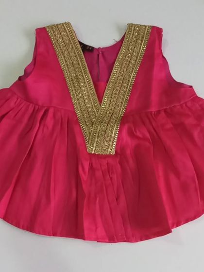 The choli from our Meera Set is made from a vibrant hot pink cotton silk. The gold lace detailing is carefully stitched to be soft against the skin, making it a beautiful and comfortable fusion top.