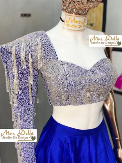 Another angle of the stunning hand-worked blouse, showcasing the craftsmanship and the unique one-shoulder design.