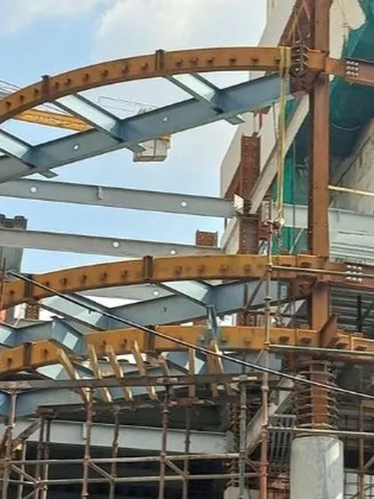 An in-progress view of the Earth Enclave residential project, one of India's first high-rise buildings constructed with a steel composite frame. This image captures the intricate steelwork, a testament to our use of advanced construction methods for superior strength and design flexibility.
