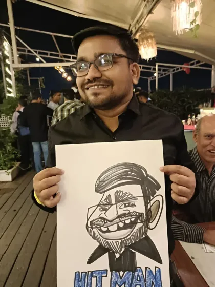 A guest at Sky Lounge Pune with his 'Hitman' caricature. It's fun to add nicknames and inside jokes.