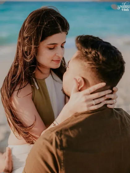 An intimate moment captured during a pre-wedding shoot on a Dubai beach. The focus here is entirely on the connection, the gentle touch, and the quiet understanding between two people. These are the unscripted moments that truly define a love story.
