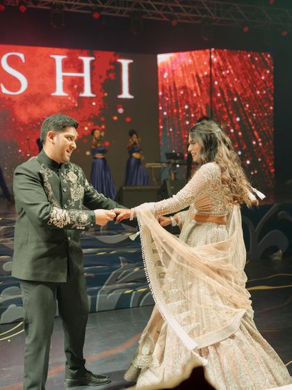 A candid moment of joy during a couple's dance. Our choreography is designed to feel natural and fun, allowing the couple's genuine connection to shine through on stage.