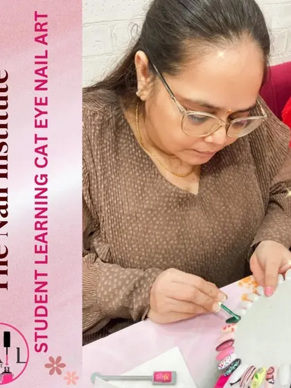 This student is learning how to create the mesmerizing cat eye effect using a special magnetic polish and tool.