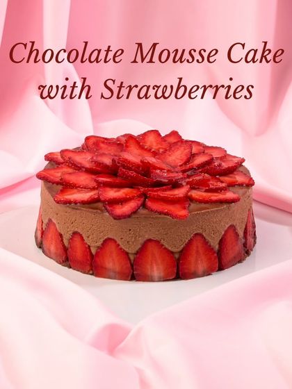 My Chocolate Mousse Cake with Strawberries. This dessert features a light, airy chocolate mousse decorated with a border and topping of freshly sliced strawberries.