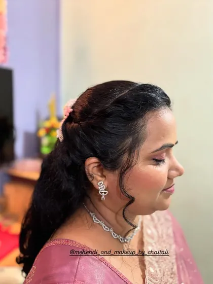 A close-up of the eye makeup for this party look. I used soft pink shades to create a gentle, defined eye that complements the client's features.
