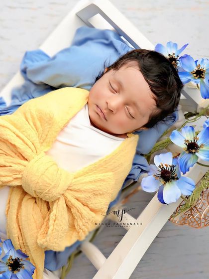 A close-up on the baby's face, showing their peaceful expression.