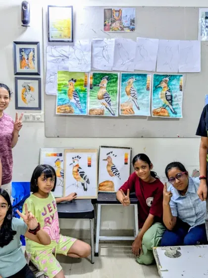 A successful bird study session! The whole group is excited to show off their fantastic watercolor paintings of the Hoopoe bird.