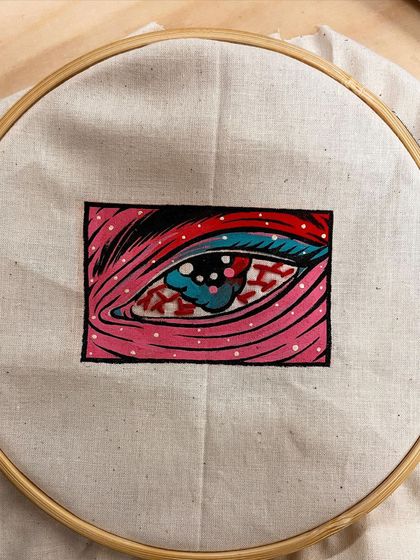 Duplicate of the embroidered eye detail.