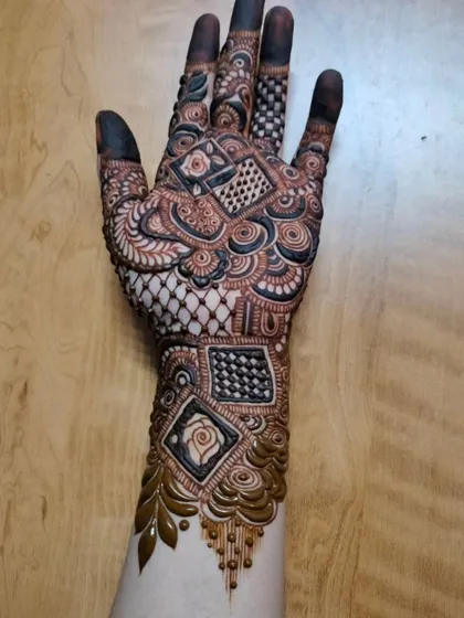 This geometric design is for the modern bride. It features squares, diamonds, and intricate grid work, creating a bold and unconventional look.