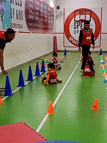 Our coaches setting up a cone drill for the little ones. These exercises are designed to improve agility and the ability to change direction quickly.