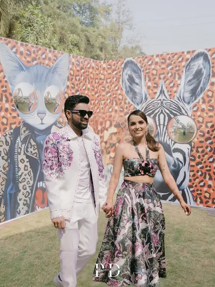 For this 'Afro Jungle Carnival' theme, we created a cool, graphic backdrop with animal prints and quirky art, giving the couple a fun and edgy setting for their photos.