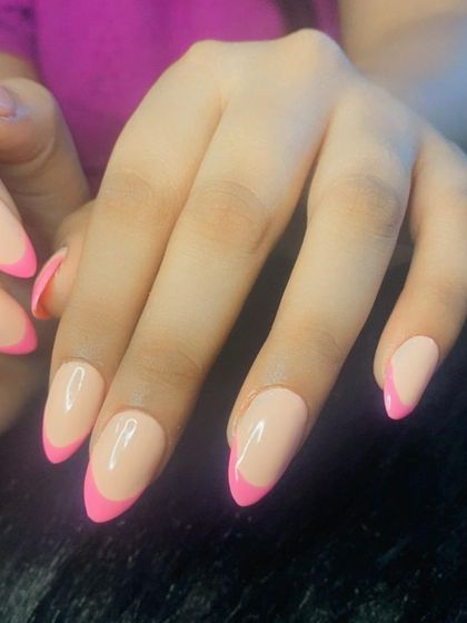 A close-up of the matte nude and glossy pink French manicure.