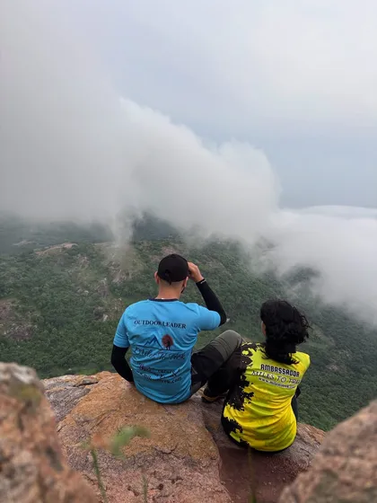 Every adventure is led by our certified and experienced outdoor leaders. We are not just guides; we are safety experts and experience curators who know the trails intimately. Here, our team members take a moment to soak in the view above the clouds, a reward we love sharing with our clients.