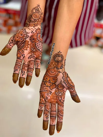 A lovely Raksha Bandhan mehendi for a sister. The intricate patterns are a beautiful way to celebrate the bond of love.