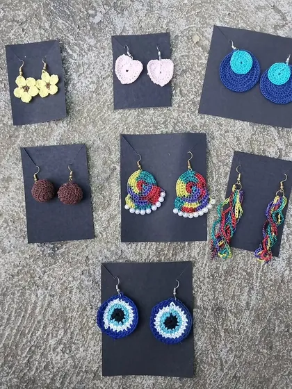 A glimpse into the variety of my handmade crochet earrings. From simple hearts and flowers to vibrant, multicolored designs, each pair is lightweight and adds a unique touch to any outfit.