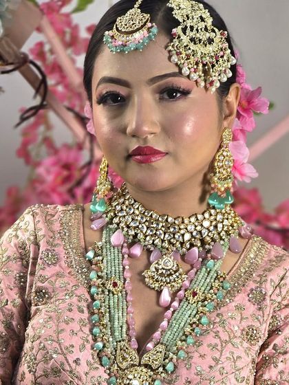 A unique pastel bridal set combining mint green and pink beads with Polki work. This shows how I can customize pieces to match modern, multi-colored lehengas.