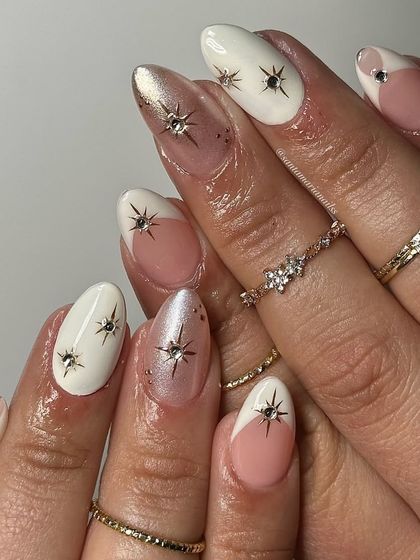 Another look at this beautiful starburst design, showing how the elements are placed across different nails for a cohesive yet varied look.