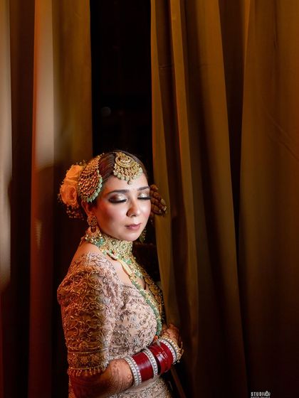 Playing with light and shadow. This artistic shot from my wedding shows how well-applied makeup looks stunning even in moody lighting, with the highlighter catching the light beautifully.