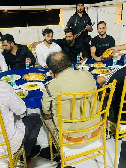 Sharing a meal with friends and associates at an event hosted by Advocate Azim. These gatherings are opportunities to strengthen bonds.