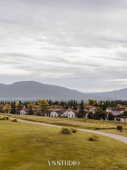 A beautiful landscape shot of a European-style village in Khao Yai, Thailand. This image sets the scene for a romantic pre-wedding story, showcasing the stunning locations we find for our shoots.