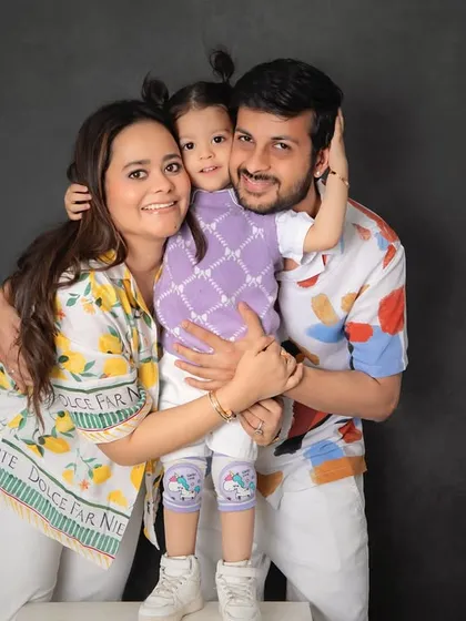 That feeling of a perfect family hug. We focus on capturing genuine connection and laughter in our family portraits, creating timeless images against a simple, classic backdrop that puts all the focus on your bond.