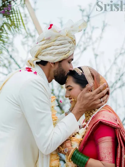 A tender kiss on the forehead. This simple, loving gesture against the backdrop of the mountains speaks volumes. It’s a moment of blessing, protection, and deep affection.