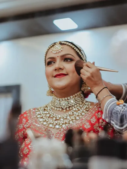 The process of perfection. Here I am applying a soft blush to give the bride a natural, healthy flush. Every step is done with precision to ensure the makeup is long lasting and photo ready.