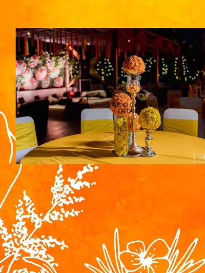 Table centerpieces are an important part of the overall decor. For this Haldi, I used tall glass vases filled with bright orange marigold arrangements to carry the festive theme throughout the venue.